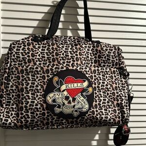 NWT Ed Hardy Weekend Traveler with Convenient Suitcase Slide and zipper closure.